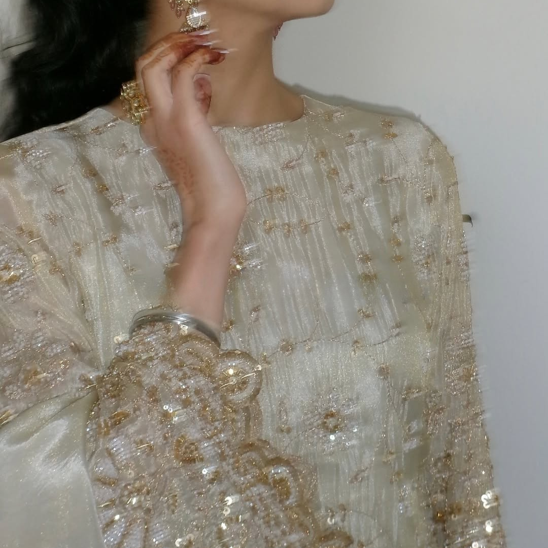 Flared plazzo Set and pearl work paired with a scalloped edge dupatta.