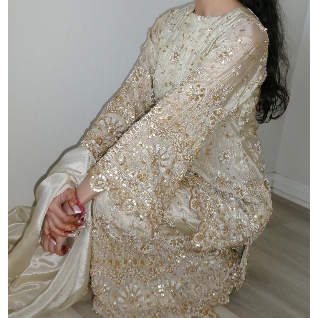 Flared plazzo Set and pearl work paired with a scalloped edge dupatta.